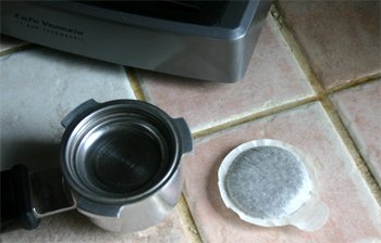 An E.S.E. espresso pod and portafilter.